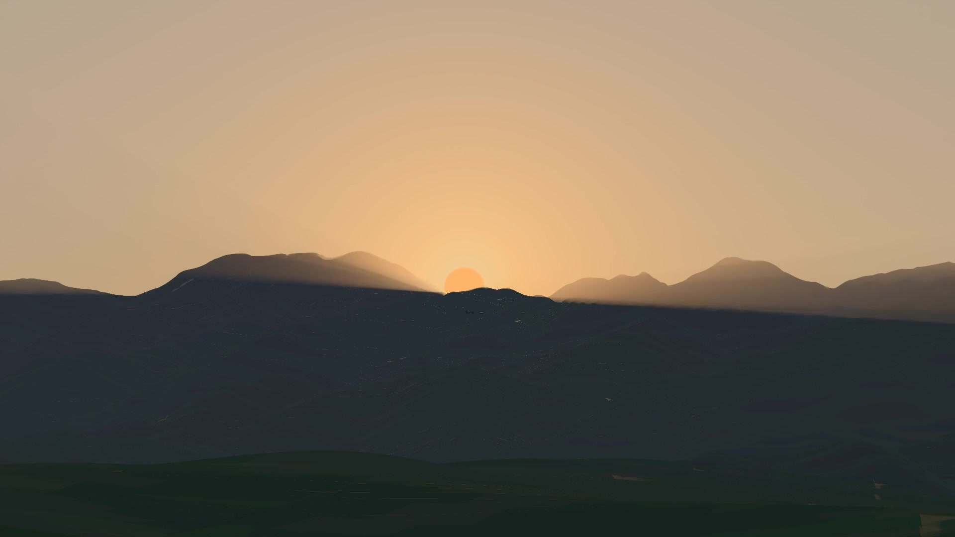The mountains casting their shadow through the air at sunset