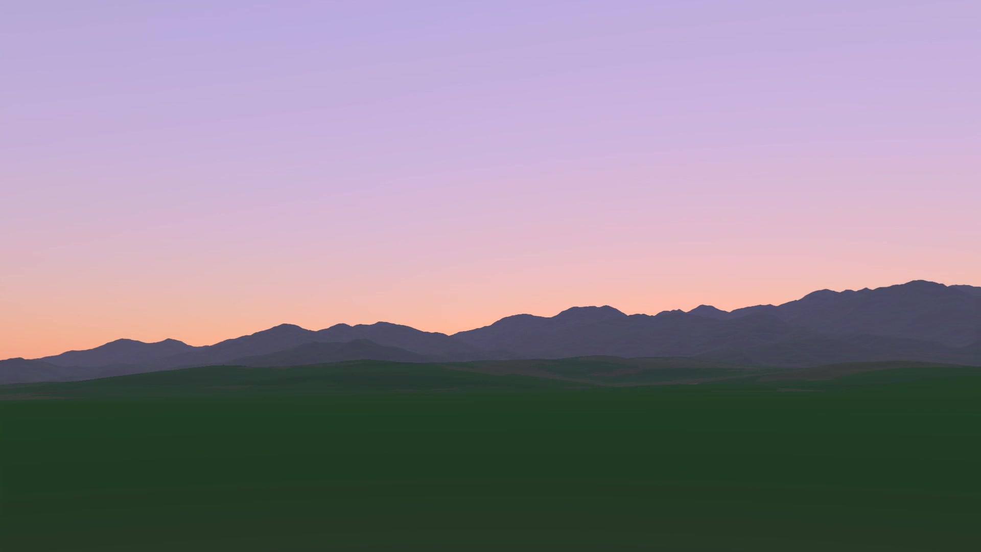 The pink band of twilight over the valley after sunset